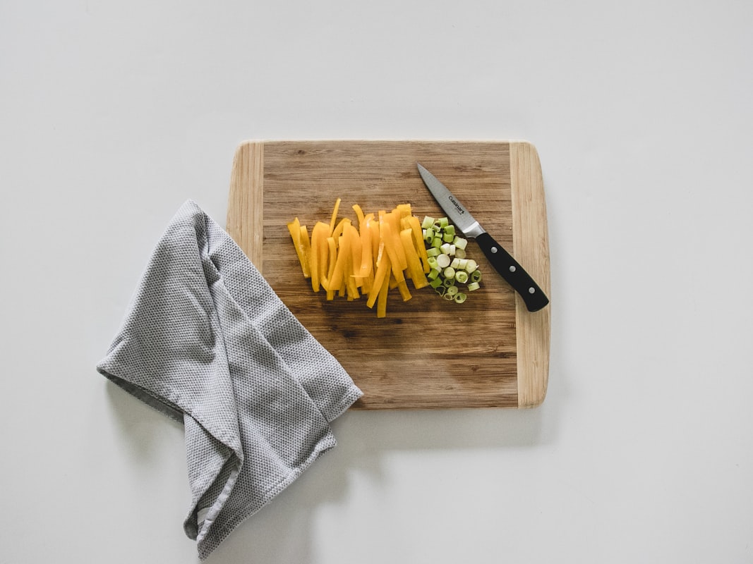Expert instructor demonstrating healthy cooking techniques in professional kitchen